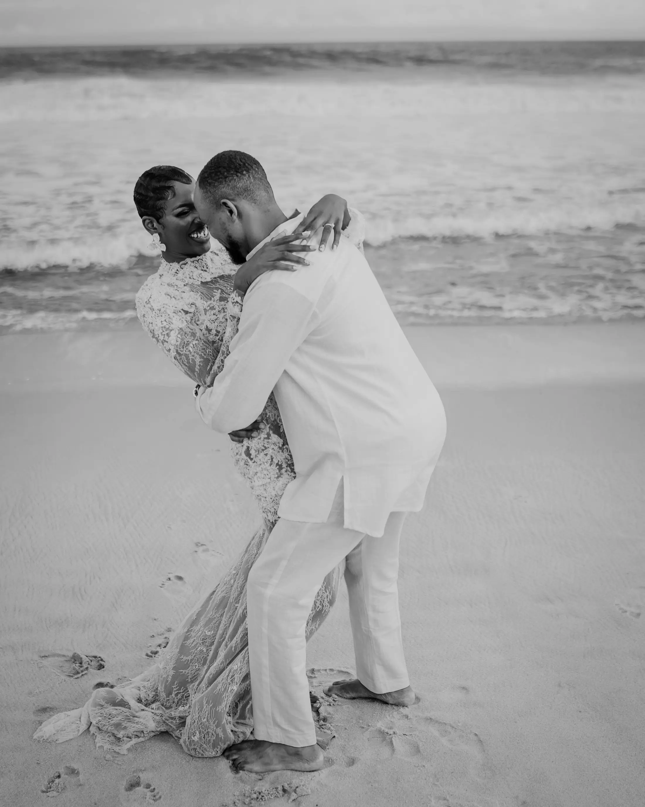 A couple laughing together on the beach